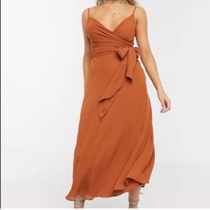 Flowy sleeveless wrap dress, rust/orange color